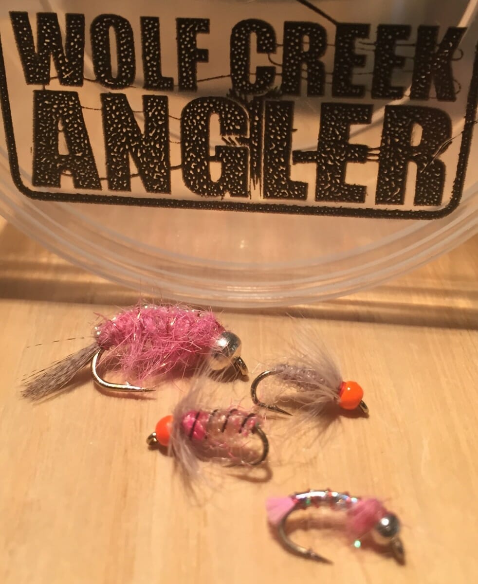 Hot February Nymphs Top to bottom; Pinkalicious, Firebead Soft Hackle Sow Bug Grey, Firebead Tungsten Sow Pink, Pink Lightning Bug. All available at Wolf Creek Angler. photo by  Wolf Creek Angler 
